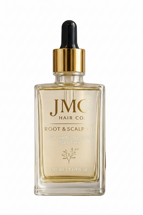 JMC Hair Co. Root & Scalp Oil in a clear glass dropper bottle with a gold collar and black dropper top, displayed on a round stone slab with olive sprigs and seeds against a white background.
